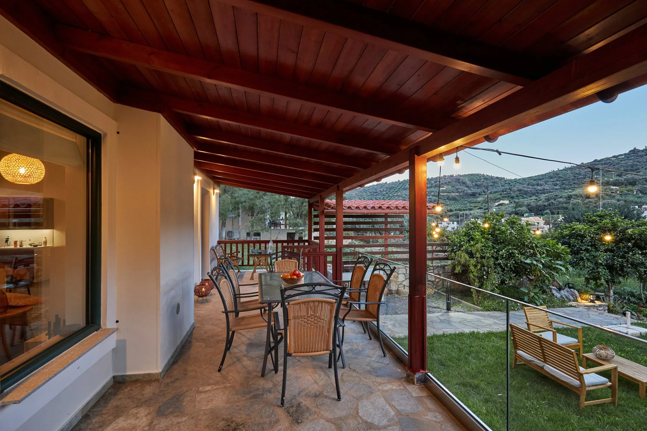 Covered veranda with outdoor dining at Yiamas Seaside Cottage in Paleokastro Covered veranda with outdoor dining at Yiamas Seaside Cottage in Paleokastro